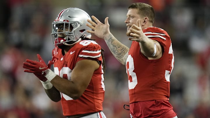 Sep 7, 2024; Columbus, Ohio, USA;  Ohio State Buckeyes tight end Gee Scott Jr. (88) and defensive end Jack Sawyer (33) celebrate after a touchdown by tight end Bennett Christian (not pictured)  against the Western Michigan Broncos during the second half at Ohio Stadium.