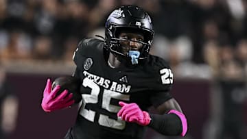 Oct 4, 2025; College Station, Texas, USA; Texas A&M Aggies defensive tackle DJ Hicks (5) runs the ball after a strip sack during the fourth quarter against the Mississippi State Bulldogs at Kyle Field. Mandatory Credit: Maria Lysaker-Imagn Images 