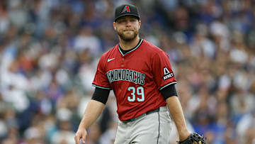 Apr 18, 2025; Chicago, Illinois, USA; Arizona Diamondbacks starting pitcher Corbin Burnes (39) reacts as he walks back to the dugout after the second inning of a baseball game against the Chicago Cubs at Wrigley Field. Mandatory Credit: Kamil Krzaczynski-Imagn Images