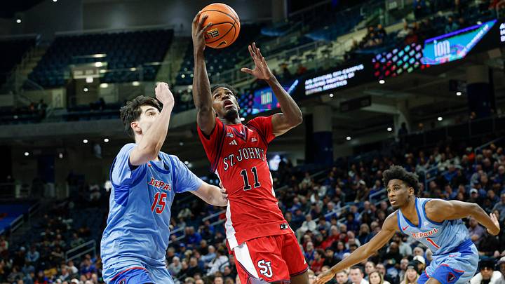 Feb 3, 2026; Chicago, Illinois, USA; St. John's Red Storm guard Ian Jackson (11) drives to the basket against DePaul Blue Demons center Fabian Flores (15) during the first half at Wintrust Arena. Mandatory Credit: Kamil Krzaczynski-Imagn Images Feb 3, 2026; Chicago, Illinois, USA; St. John's Red Storm guard Ian Jackson (11) drives to the basket against DePaul Blue Demons center Fabian Flores (15) during the first half at Wintrust Arena. Mandatory Credit: Kamil Krzaczynski-Imagn Images