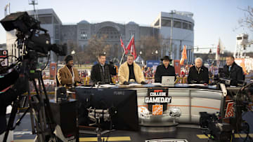 ESPN cast, from left, Desmond Howard, Rece Davis, Pat McAfee, Nick Saban, Lee Corso and Kirk Herbstreit sit on the set of College GameDay prior to the College Football Playoff first round game between the Ohio State Buckeyes and Tennessee Volunteers in Columbus on Dec. 21, 2024.