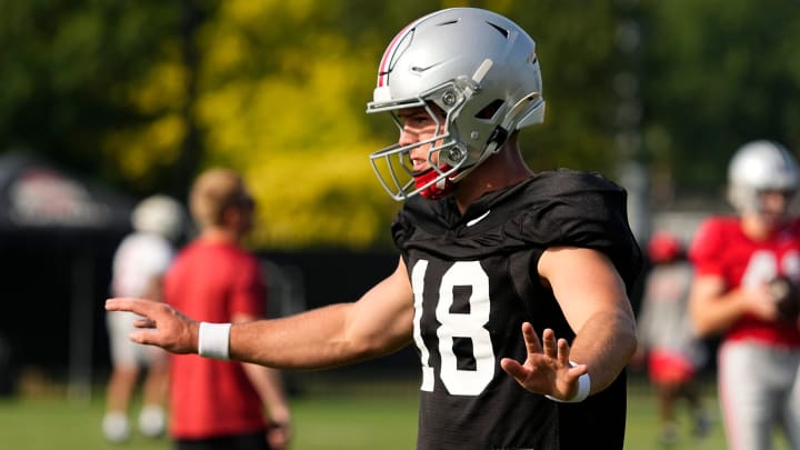 Aug 8, 2024; Columbus, Ohio, USA; Ohio State Buckeyes quarterback Will Howard (18) takes a snap during football practice at the Woody Hayes Athletic Complex.