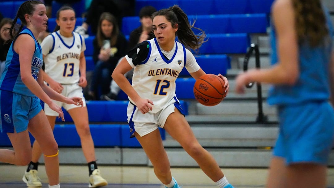 Olentangy's Whitney Stafford (12) dribbles the ball against Olentangy Berlin during the game at Olentangy High School on Wednesday, Jan. 8, 2025 in Lewis Center, Ohio.