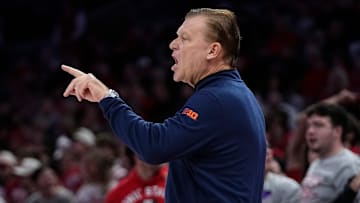 Illinois Fighting Illini head coach Brad Underwood motions to his team during the first half of the NCAA men's basketball game against the Ohio State Buckeyes in Columbus on Dec. 9, 2025.