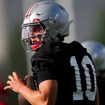 Ohio State Buckeyes quarterback Julian Sayin (10) takes a snap during football training camp at the Woody Hayes Athletic Center on Aug. 1, 2025.