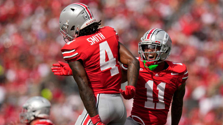 Aug 31, 2024; Columbus, OH, USA; Ohio State Buckeyes wide receiver Brandon Inniss (11) celebrates a touchdown catch by wide receiver Jeremiah Smith (4) during the first half of the NCAA football game against the Akron Zips at Ohio Stadium.