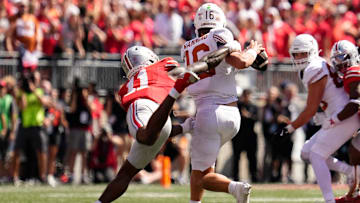 Ohio State Buckeyes linebacker C.J. Hicks (11) pressures Texas Longhorns quarterback Arch Manning (16) during the second half of the NCAA football game at Ohio Stadium on Aug. 30, 2025. Ohio State won 14-7.