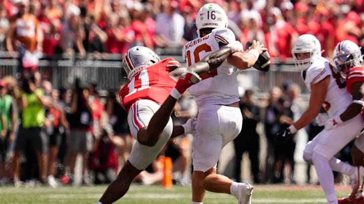 Ohio State Buckeyes linebacker C.J. Hicks (11) pressures Texas Longhorns quarterback Arch Manning (16) during the second half of the NCAA football game at Ohio Stadium on Aug. 30, 2025. Ohio State won 14-7.