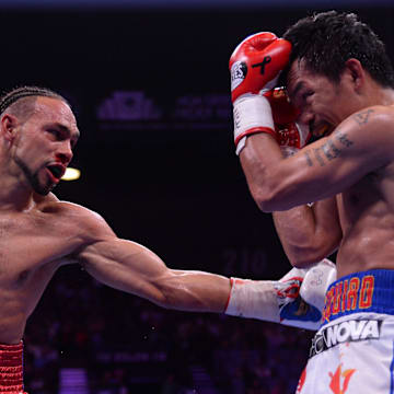 Manny Pacquiao (white trunks) and Keith Thurman (red/white/blue trunks) box during their WBA welterweight championship bout at MGM Grand Garden Arena. Pacquiao won via split decision. 