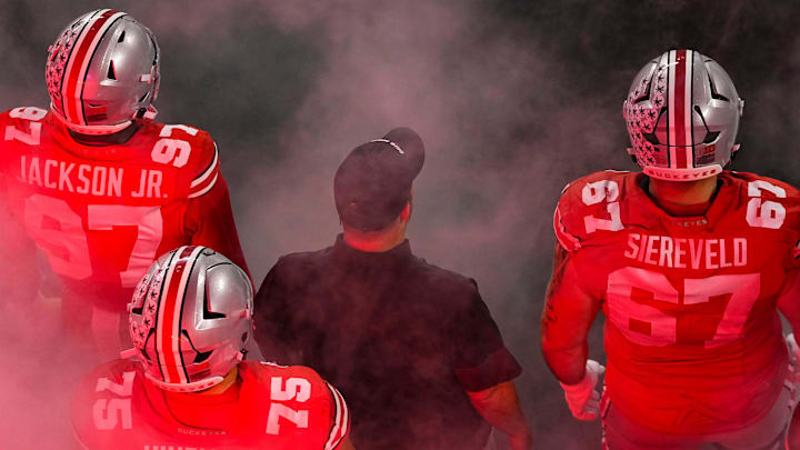 Ohio State Buckeyes defensive end Kenyatta Jackson Jr. (97), offensive lineman Carson Hinzman (75), head coach Ryan Day and offensive lineman Austin Siereveld (67) take the field prior to the NCAA football game against the Minnesota Golden Gophers at Ohio Stadium in Columbus on Oct. 4, 2025. Ohio State Buckeyes defensive end Kenyatta Jackson Jr. (97), offensive lineman Carson Hinzman (75), head coach Ryan Day and offensive lineman Austin Siereveld (67) take the field prior to the NCAA football game against the Minnesota Golden Gophers at Ohio Stadium in Columbus on Oct. 4, 2025.