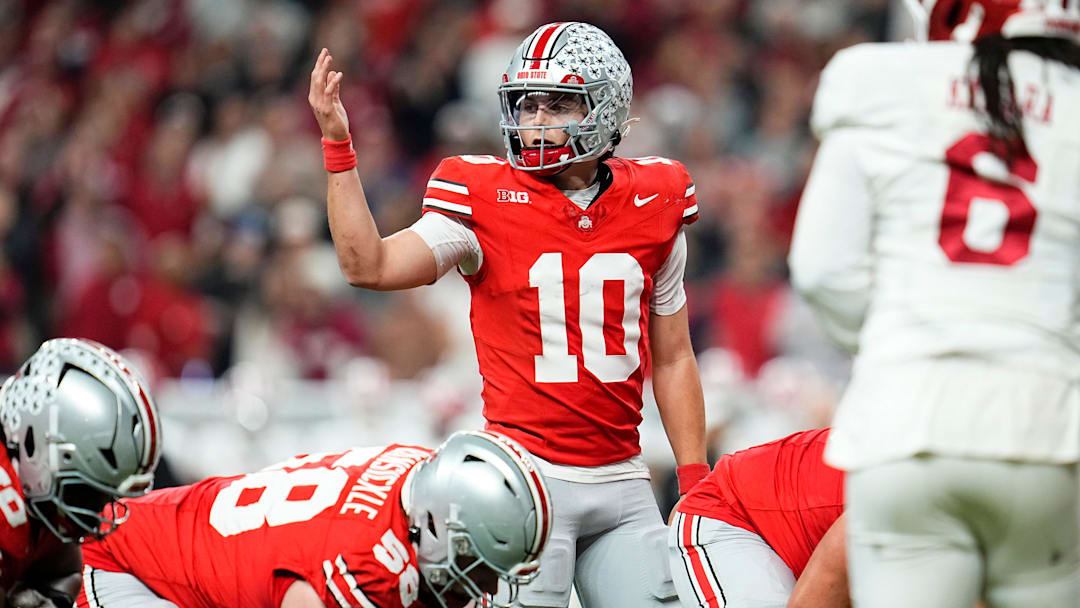 Ohio State Buckeyes quarterback Julian Sayin (10) motions during the Big Ten Conference championship game against the Indiana Hoosiers at Lucas Oil Stadium in Indianapolis on Dec. 6, 2025. Ohio State lost 13-10.