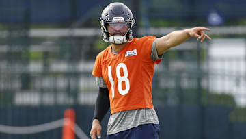 Jul 24, 2025; Lake Forest, IL, USA; Chicago Bears quarterback Caleb Williams (18) signals during training camp at Halas Hall. Mandatory Credit: Kamil Krzaczynski-Imagn Images