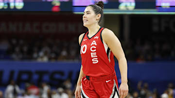 Aug 25, 2024; Chicago, Illinois, USA; Las Vegas Aces guard Kelsey Plum (10) smiles during the first half of a basketball game against the Chicago Sky at Wintrust Arena. Mandatory Credit: Kamil Krzaczynski-Imagn Images
