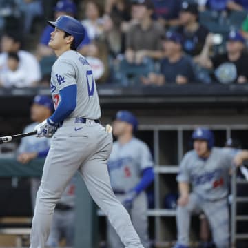 Jun 26, 2024; Chicago, Illinois, USA; Los Angeles Dodgers designated hitter Shohei Ohtani (17) watches his solo home run against the Chicago White Sox during the first inning at Guaranteed Rate Field.