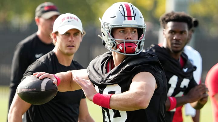 Aug 1, 2024; Columbus, OH, USA; Ohio State Buckeyes quarterback Will Howard (18) throws during football camp at the Woody Hayes Athletic Complex.