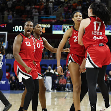 Aug 25, 2024; Chicago, Illinois, USA; Las Vegas Aces center A'ja Wilson (22) celebrates with teammates after scoring game winning basket against the Chicago Sky during the second half at Wintrust Arena. Mandatory Credit: Kamil Krzaczynski-USA TODAY Sports