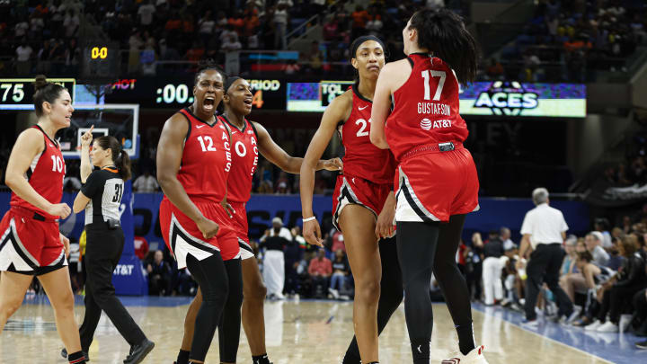 Aug 25, 2024; Chicago, Illinois, USA; Las Vegas Aces center A'ja Wilson (22) celebrates with teammates after scoring game winning basket against the Chicago Sky during the second half at Wintrust Arena. Mandatory Credit: Kamil Krzaczynski-USA TODAY Sports