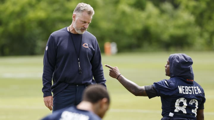 Matt Eberflus listens to a point being made by Nsimba Webster at Bears minicamp. Eberflus is a coach of the year favorite but also said to be one of the hot seat candidates.
