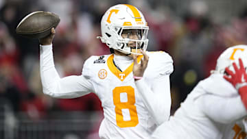 Dec 21, 2024; Columbus, Ohio, USA; Tennessee Volunteers quarterback Nico Iamaleava (8) throws against the Ohio State Buckeyes during the second half of the College Football Playoff first round game at Ohio Stadium. Ohio State won 42-17. Mandatory Credit: Adam Cairns-Imagn Images