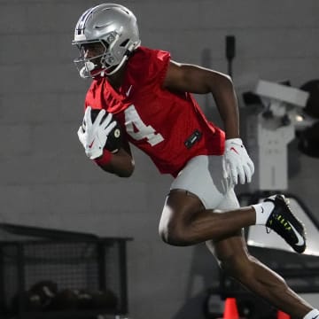 Mar 7, 2024; Columbus, OH, USA; Ohio State Buckeyes wide receiver Jeremiah Smith (4) catches a pass during spring football practice at the Woody Hayes Athletic Center.