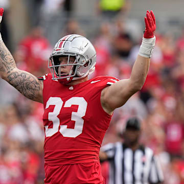 Aug 31, 2024; Columbus, OH, USA; Ohio State Buckeyes defensive end Jack Sawyer (33) tries to hype the crowd during the first half of the NCAA football game against the Akron Zips at Ohio Stadium.