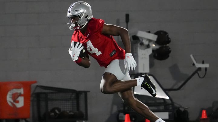 Mar 7, 2024; Columbus, OH, USA; Ohio State Buckeyes wide receiver Jeremiah Smith (4) catches a pass during spring football practice at the Woody Hayes Athletic Center.