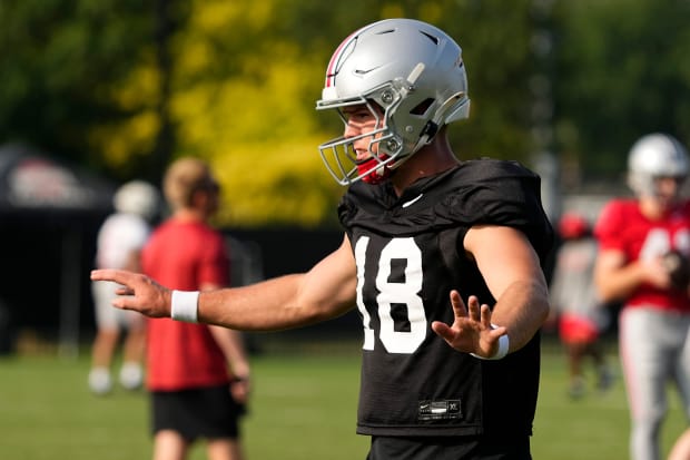 Quarterback gets set for snap in practice.