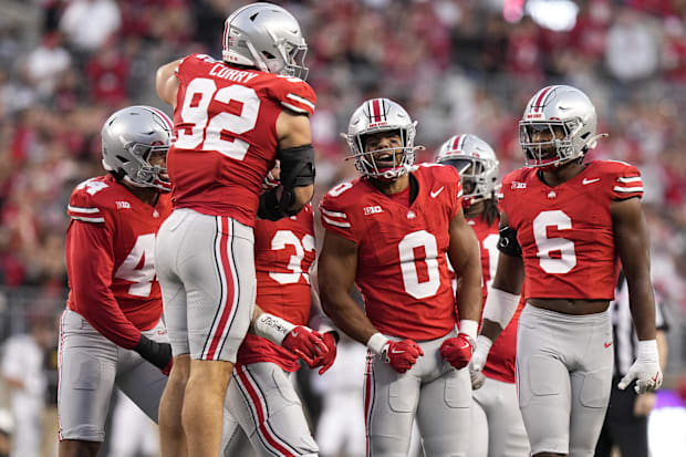 Defensive players celebrate after big play.