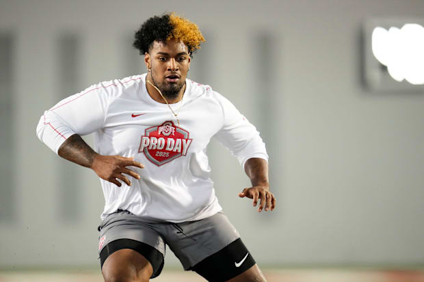 Ohio State Buckeyes offensive lineman Josh Simmons works out during the pro day for NFL scouts.