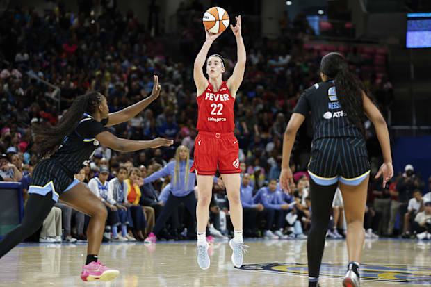 Indiana Fever guard Caitlin Clark (22) shoots against the Chicago Sky during the first half at Wintrust Arena