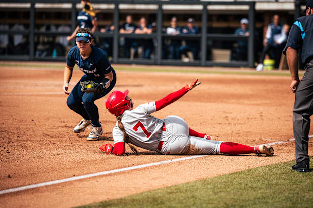 Nebraska shortstop Ava Kuszak slides safely into third base against Penn State during the Big Ten Tournament quarterfinals.