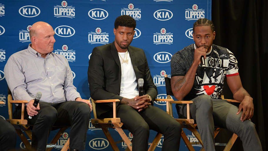 Clippers owner Steve Ballmer, Paul George and Kawhi Leonard at a press conference.
