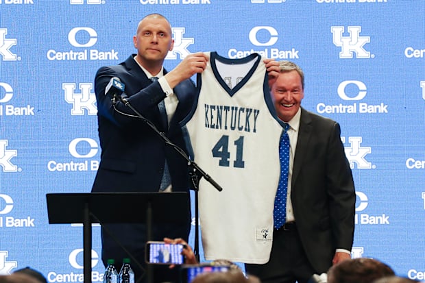 Pope, with his actual game jersey, poses with Barnhart during his introduction in April.