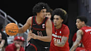 Mar 8, 2025; Louisville, Kentucky, USA;  Stanford Cardinal guard Ryan Agarwal (11) dribbles against Louisville Cardinals guard Chucky Hepburn (24) during the second half at KFC Yum! Center. Louisville defeated Stanford 68-48. Mandatory Credit: Jamie Rhodes-Imagn Images