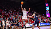 Dec 10, 2024; Piscataway, New Jersey, USA; Rutgers Scarlet Knights guard Ace Bailey (4) goes to the basket asPenn State Nittany Lions guard Freddie Dilione V (4) and guard Ace Baldwin Jr. (1) defend during the second half at Jersey Mike's Arena. Mandatory Credit: Vincent Carchietta-Imagn Images