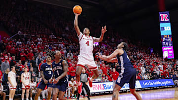 Dec 10, 2024; Piscataway, New Jersey, USA; Rutgers Scarlet Knights guard Ace Bailey (4) goes to the basket asPenn State Nittany Lions guard Freddie Dilione V (4) and guard Ace Baldwin Jr. (1) defend during the second half at Jersey Mike's Arena. Mandatory Credit: Vincent Carchietta-Imagn Images