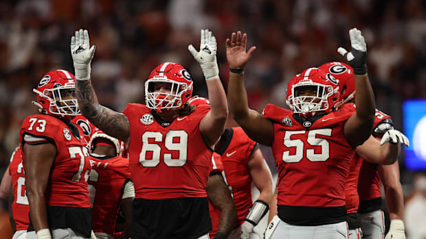 Georgia Bulldogs OL Tate Ratledge and Jared Wilso