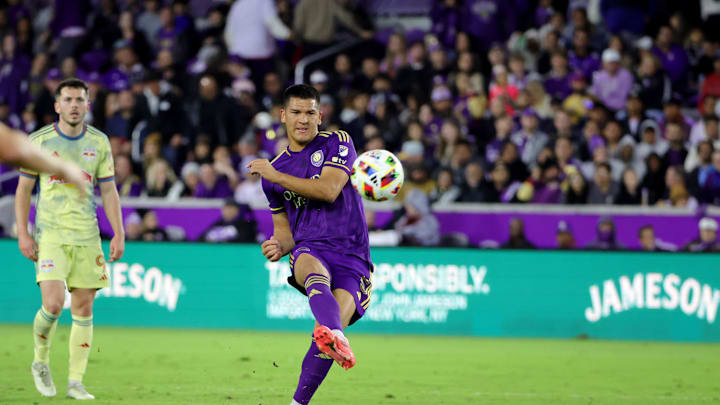 Nov 30, 2024; Orlando, Florida, USA; Orlando City midfielder Cesar Araujo (5) kicks the ball against the New York Red Bulls during the second half in the 2024 MLS Cup Eastern Conference Final match at Inter&Co Stadium. Mandatory Credit: Mike Watters-Imagn Images