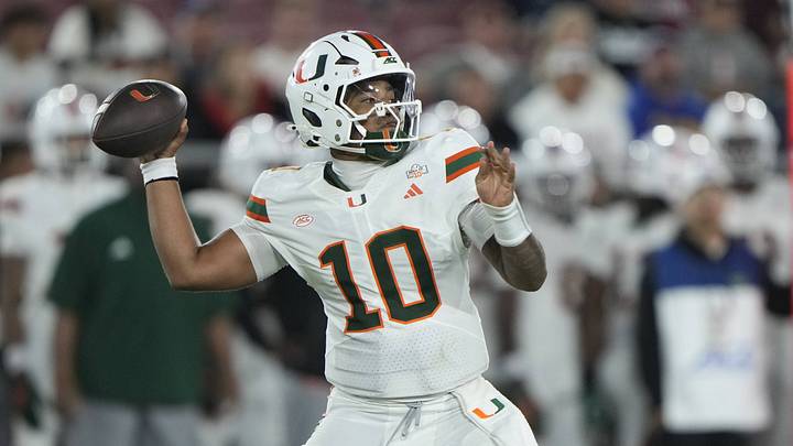 Sep 4, 2026; Stanford, California, USA;  Miami Hurricanes quarterback Darian Mensah (10) stands in the pocket against the Stanford Cardinal during the third quarter at Stanford Stadium.  Mandatory Credit: Stan Szeto-Imagn Images