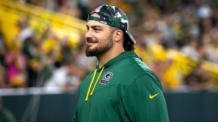 Green Bay Packers tackle David Bakhtiari smiles at fans during Packers Family Night on Aug. 5, 2022, at Lambeau Field.