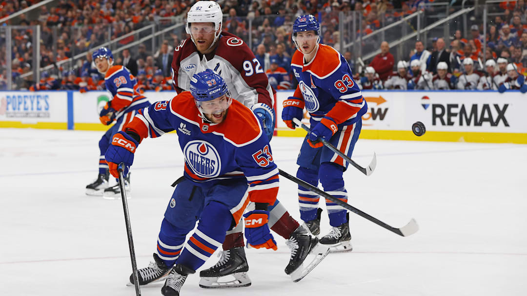 Apr 13, 2026; Edmonton, Alberta, CAN; Edmonton Oilers forward Issac Howard (53) and Colorado Avalanche forward Gabriel Landeskog (92) looks for a loose puck during the second period at Rogers Place. Mandatory Credit: Perry Nelson-Imagn Images