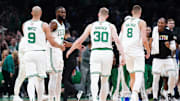 Jun 6, 2024; Boston, Massachusetts, USA; Boston Celtics forward Sam Hauser (30) and guard Jaylen Brown (7) react in the first quarter against the Dallas Mavericks during game one of the 2024 NBA Finals at TD Garden. Mandatory Credit: David Butler II-Imagn Images
