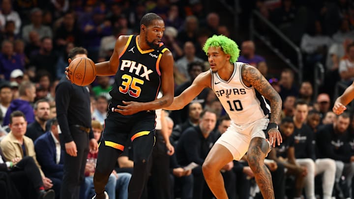 Dec 3, 2024; Phoenix, Arizona, USA; San Antonio Spurs forward Jeremy Sochan (10) against Phoenix Suns forward Kevin Durant (35) during an NBA Cup game at Footprint Center. Mandatory Credit: Mark J. Rebilas-Imagn Images Dec 3, 2024; Phoenix, Arizona, USA; San Antonio Spurs forward Jeremy Sochan (10) against Phoenix Suns forward Kevin Durant (35) during an NBA Cup game at Footprint Center. Mandatory Credit: Mark J. Rebilas-Imagn Images