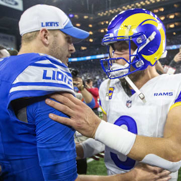 Detroit Lions quarterback Jared Goff (16) and Los Angeles Rams quarterback Matthew Stafford (9) greet each other 