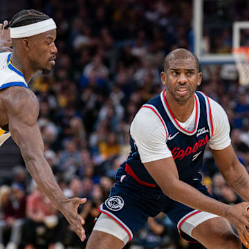 Oct 28, 2025; San Francisco, California, USA; LA Clippers guard Chris Paul prepares to pass the basketball against Golden State Warriors forward Jimmy Butler III (10) during the third quarter at Chase Center. Mandatory Credit: Neville E. Guard-Imagn Images