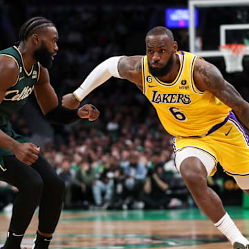 Jan 28, 2023; Boston, Massachusetts, USA; Los Angeles Lakers forward LeBron James (6) drives to the basket defended by Boston Celtics forward Jaylen Brown (7) during the second half at TD Garden. Mandatory Credit: Paul Rutherford-Imagn Images