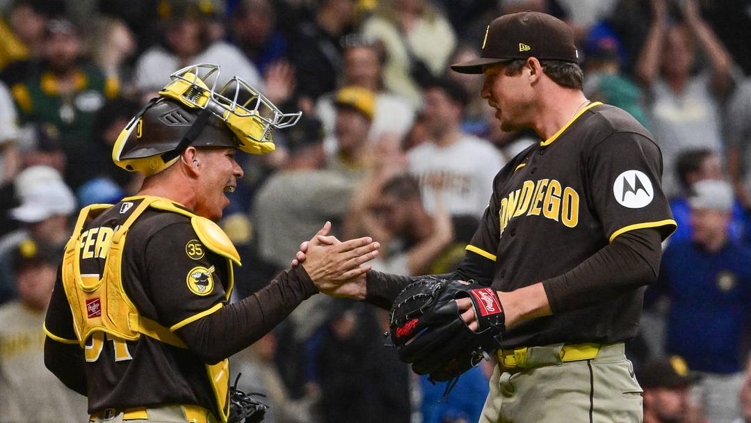 May 13, 2026; Milwaukee, Wisconsin, USA; San Diego Padres pitcher Mason Miller (22) celebrates with catcher Rodolfo Duran (48) after picking up a save against the Milwaukee Brewers at American Family Field. Mandatory Credit: Benny Sieu-Imagn Images