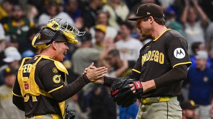 May 13, 2026; Milwaukee, Wisconsin, USA; San Diego Padres pitcher Mason Miller (22) celebrates with catcher Rodolfo Duran (48) after picking up a save against the Milwaukee Brewers at American Family Field. Mandatory Credit: Benny Sieu-Imagn Images
