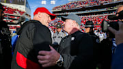 Louisville head coach Jeff Brohm congratulates Kentucky head coach Mark Stoops after the Wildcats beat Louisville 38-31 Saturday and retaining the Governor's Cup. It was Brohm's first Governor's Cup game as head coach for UofL. Nov. 24, 2023