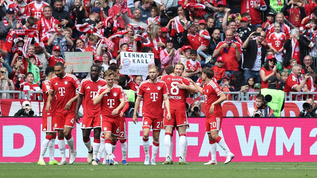 Bayern Munich players celebrating a goal against FC Koln.